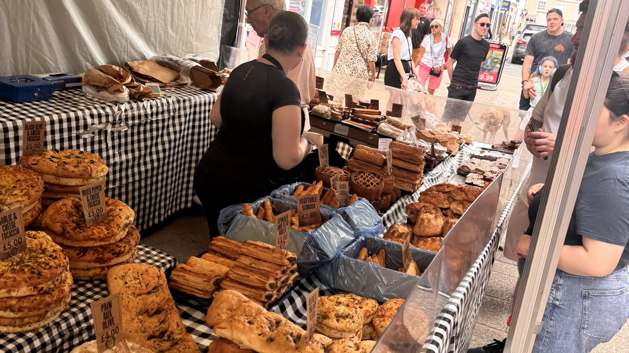 An artisan bakery stall full of breads and cakes at Beccles Sunday Market