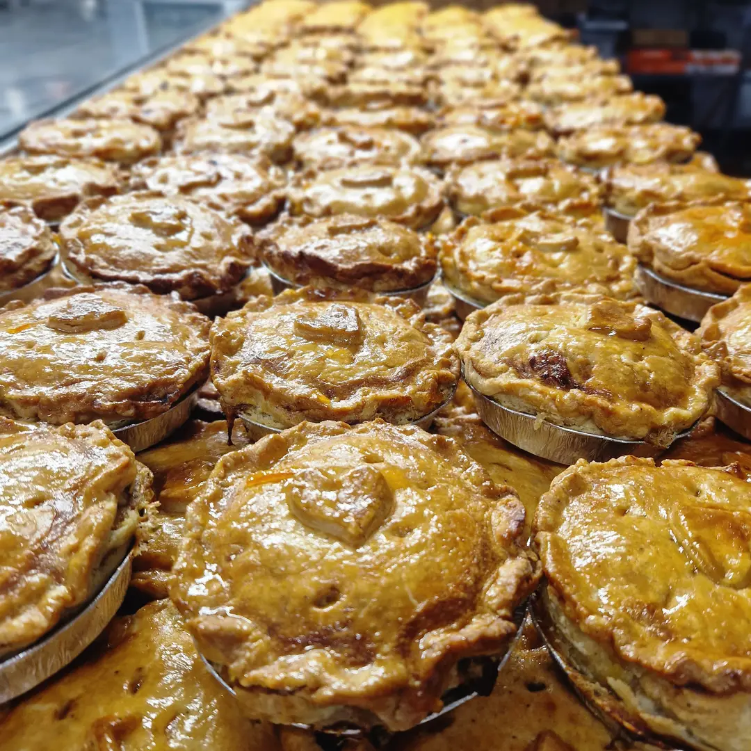 Golden pork pies on a market stall
