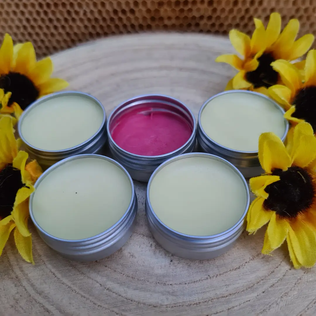 Handmade poured candles arranged with sunflowers