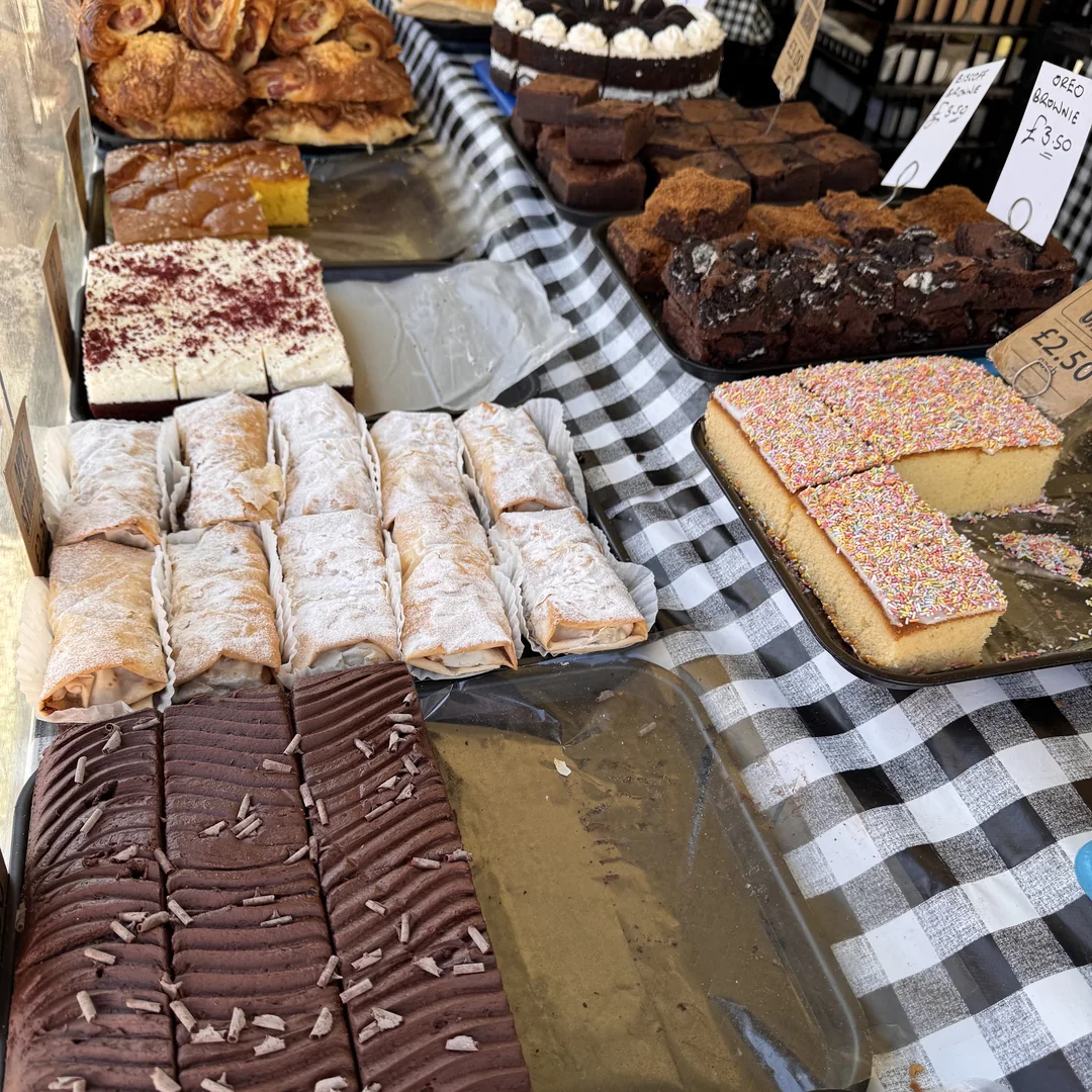 Cakes, slices and traybakes laid out on a market stall in Beccles