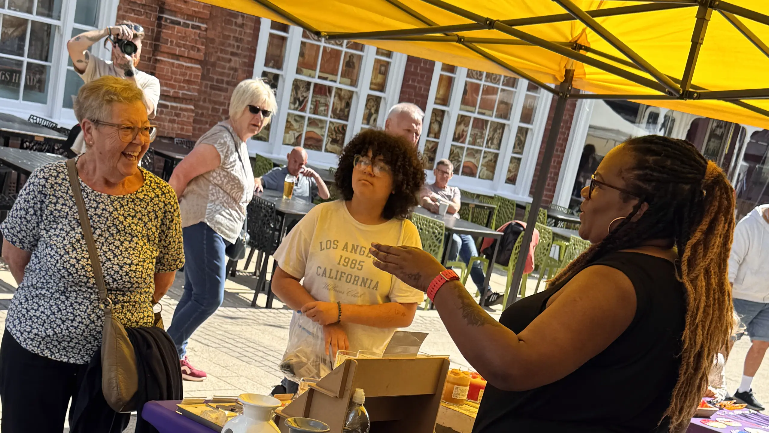 Visitors chatting with a trader at a Beccles Sunday Market stall